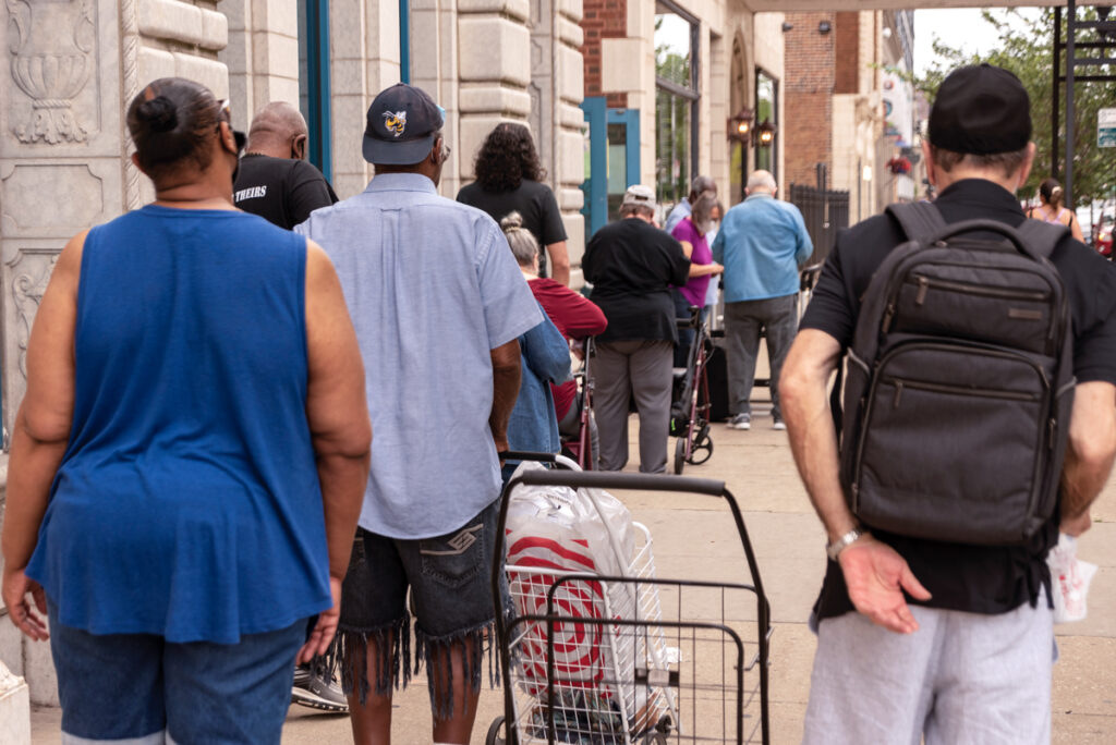A line of Ezra clients waiting outside of the food pantry for their turn at the cafe