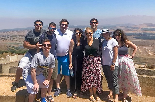 A group of young adults posing for a picture on a YLD mission.