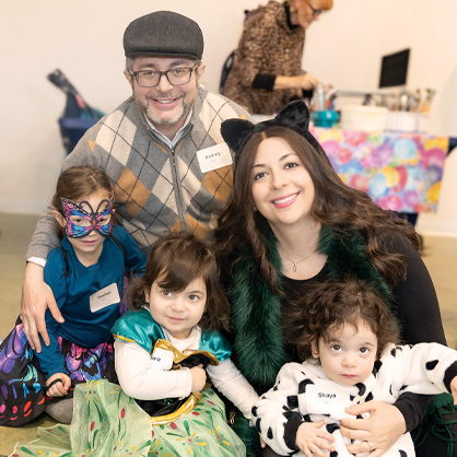 A family dressed up for purim.
