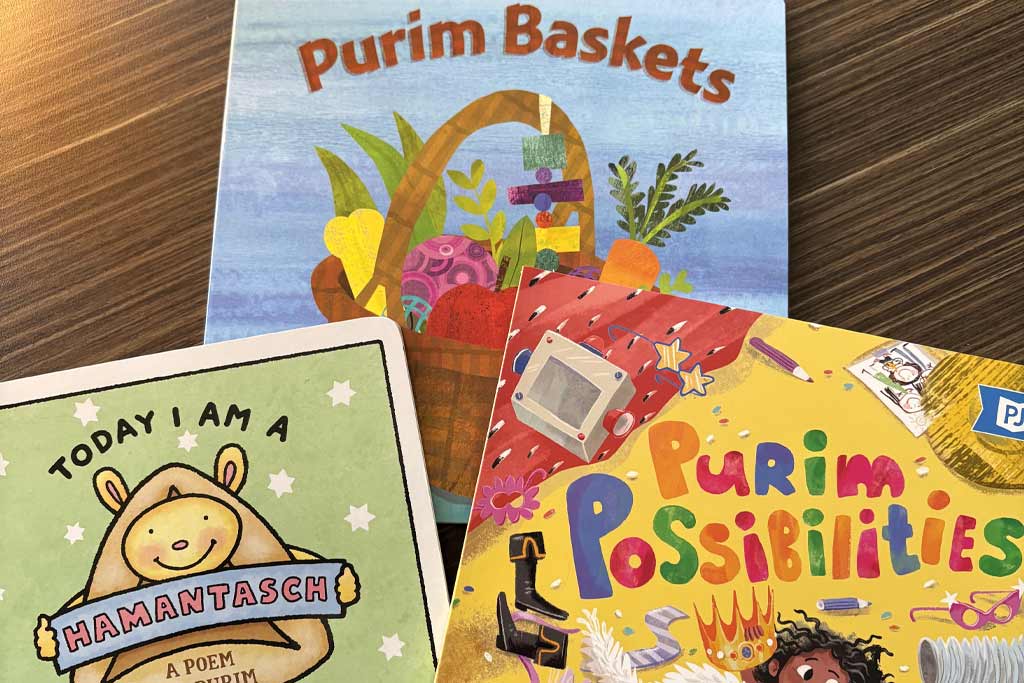 Three new board books about the experience of Purim, from PJ Publishing. (Photo courtesy of PJ Library)