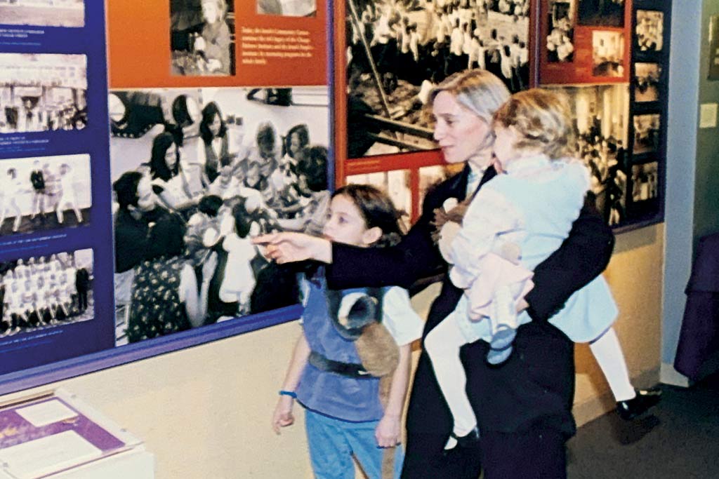 Paula Harris&mdash;working mom&nbsp;extraordinaire&mdash;pictured&nbsp;here&nbsp;touring the opening&nbsp;JUF Centennial&nbsp;Campaign&nbsp;event at Spertus&nbsp;Institute in 2000, with&nbsp;her two young daughters in&nbsp;tow.