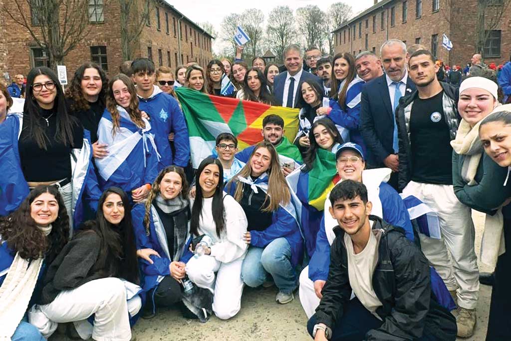 Israel&rsquo;s Ministry of Education youth delegation, pictured with the Minister of Education, Yoav Kisch, all wrapped in Israeli and Druze flags.