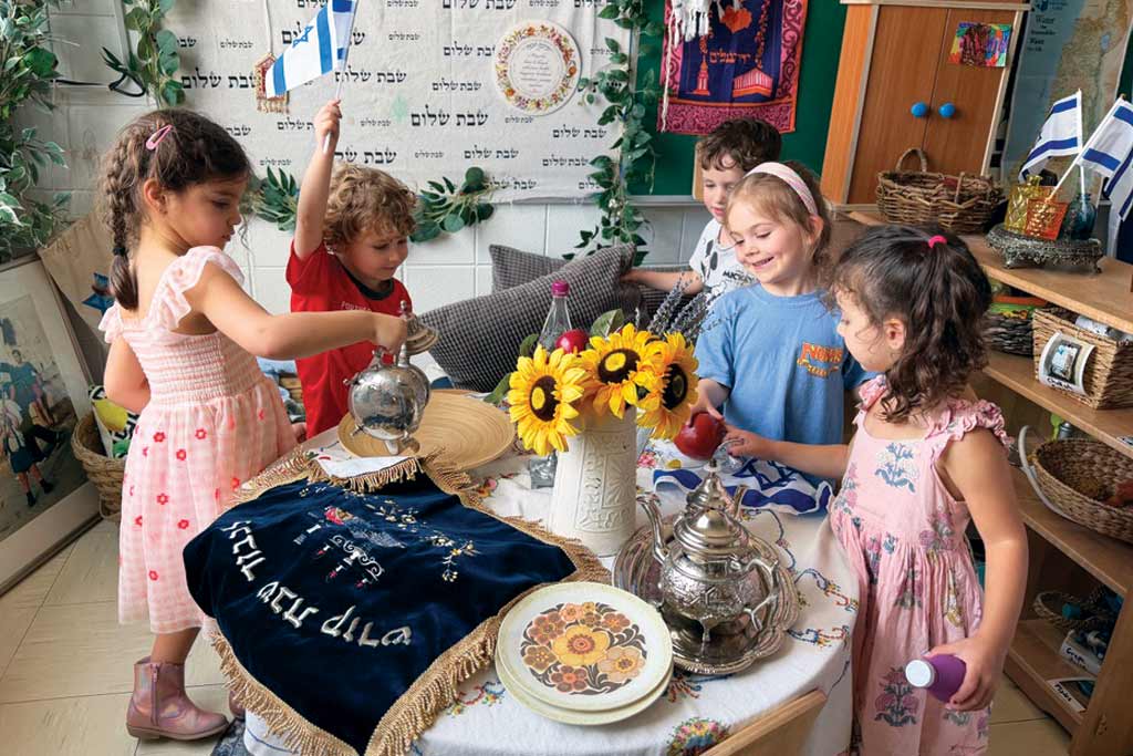 Kids helping with shabbat preparation.
