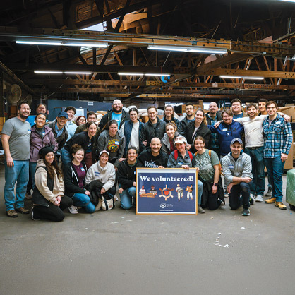 Over 35 young adults (pictured) visited the Chicago Furniture Bank with YLD and TOV. Volunteers sorted donations, assembled new furniture, and organized the furniture showroom. (Photo credit: Matthew Reitman)