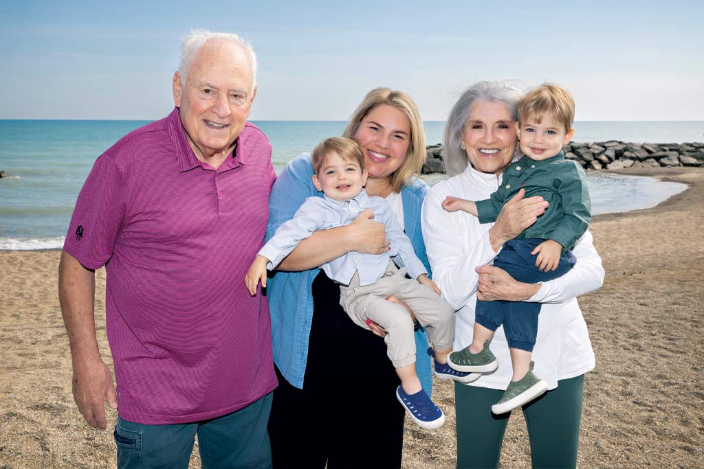 a photo of James Anixter with his wife, Lesley, and daughter, Courtney, and her sons, Watts and Stiles.