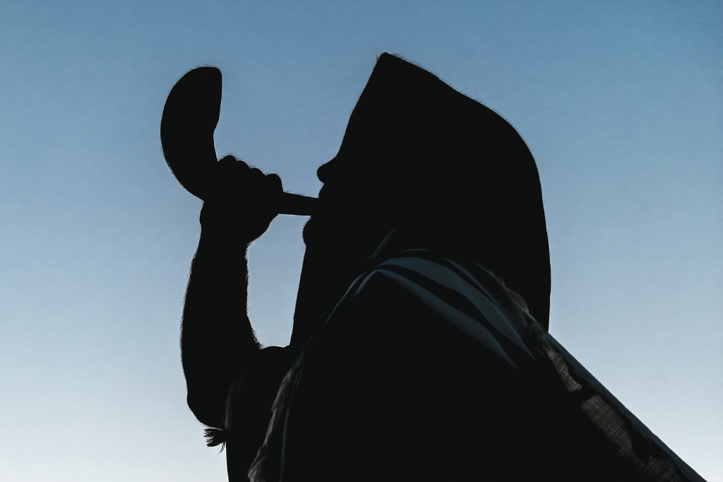 An image of someone blowing a shofar
