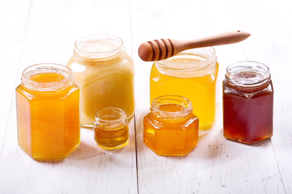 A photo of jars of honey