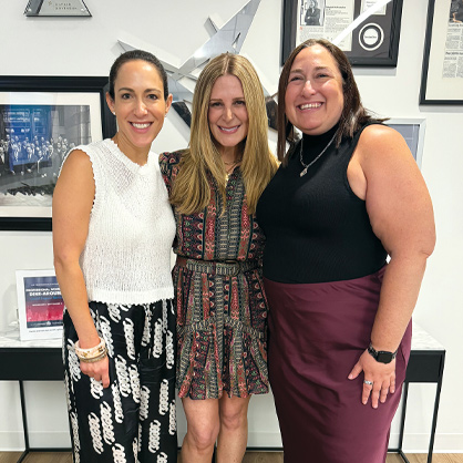 A photo of three women at JUF's professional women's cohort.
