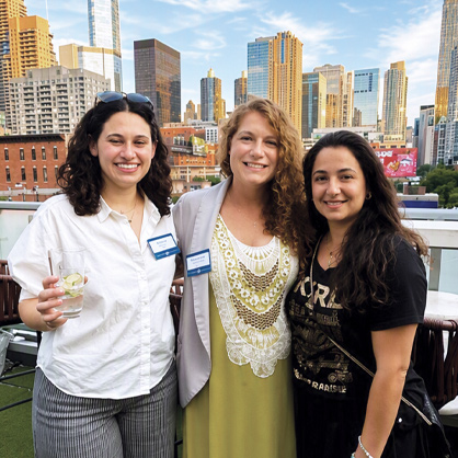A photo of three women at JUF's Real Estate Happy Hour