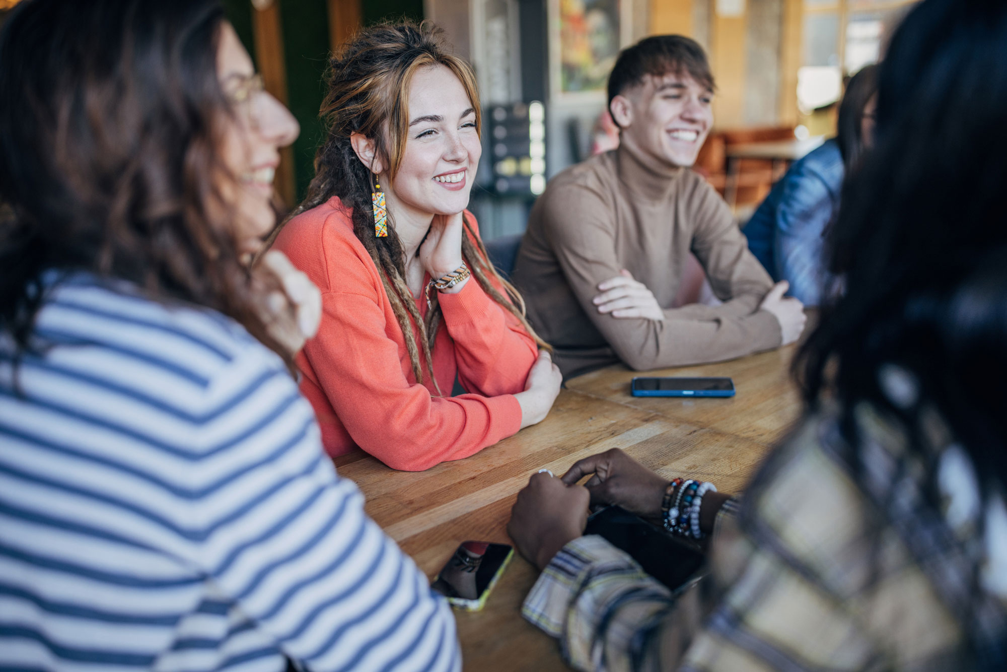 A photos of people talking at a table