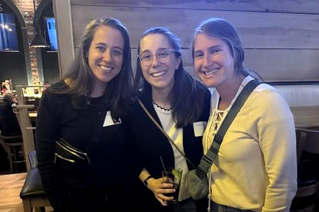A photo of three girls smiling