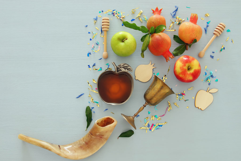 an image of apples and honey with a shofar