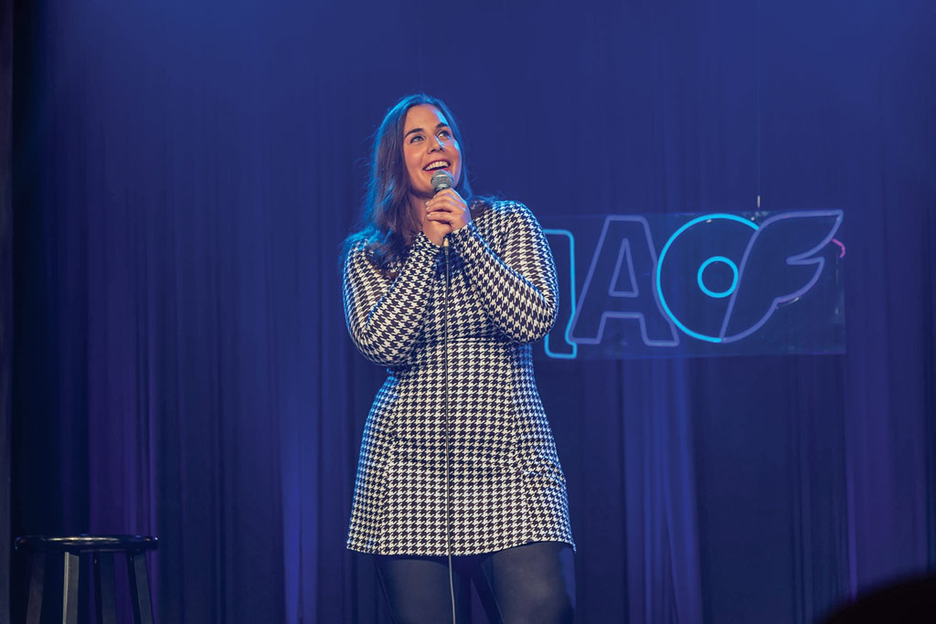 A photo of Rebecca Joey Schwab on stage