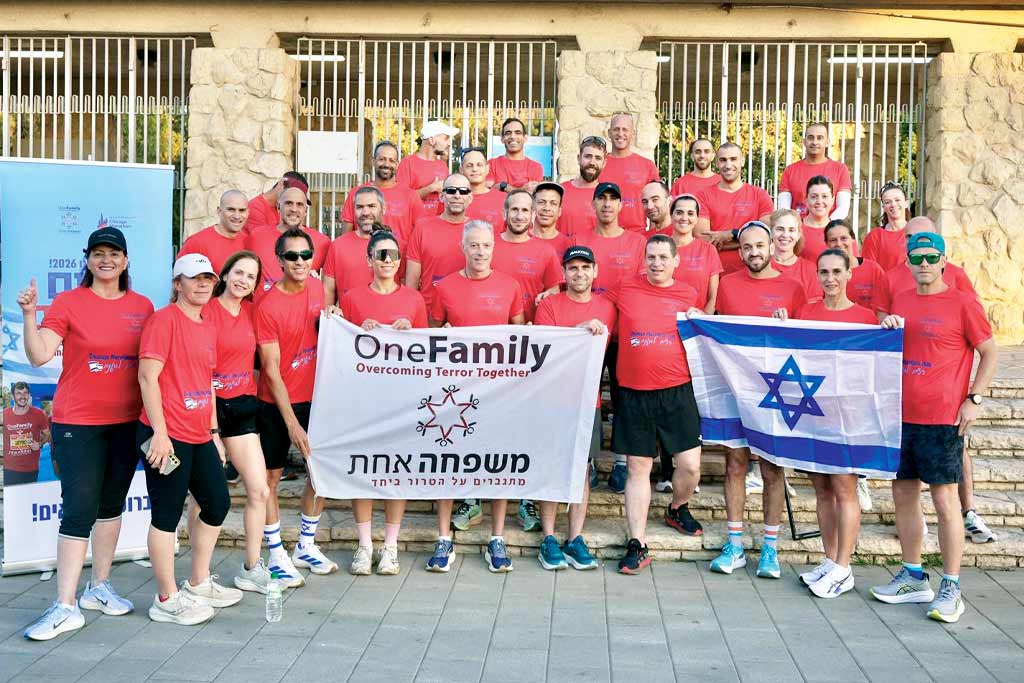 A photo of members of the OneFamily delegation after a run, preparing for the 2026 Chicago Marathon.