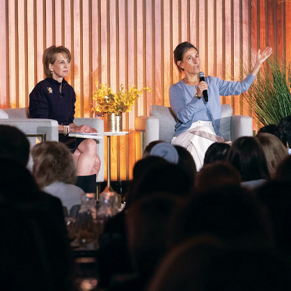 A photo of Liz Schrayer in conversation with Rachel Goldberg-Polin