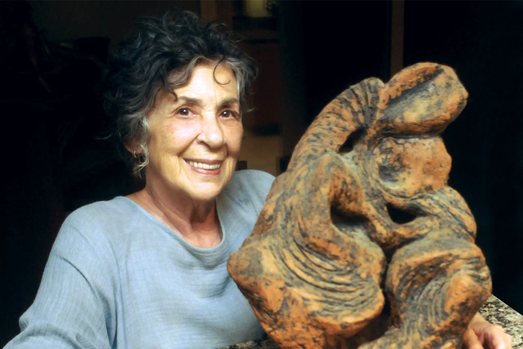 A photo of Sharron Pierce who works several times a week at the Lincoln Square Pottery Studio.