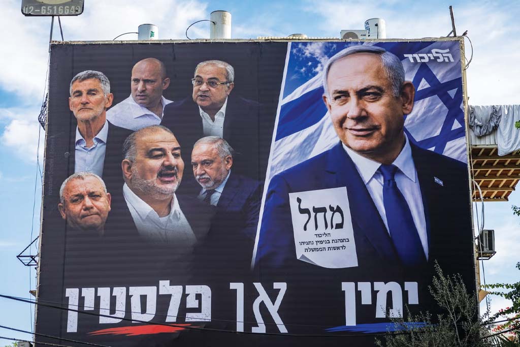 A photo of a giant election campaign poster displayed on a building in the southern Israeli city of Ashdod, showing Prime Minister and Likud party chairman Benjamin Netanyahu alongside leaders of opposition parties, with the slogan &ldquo;Right or Palestine,&rdquo; ahead of Israel&rsquo;s upcoming general elections, October 5, 2026.