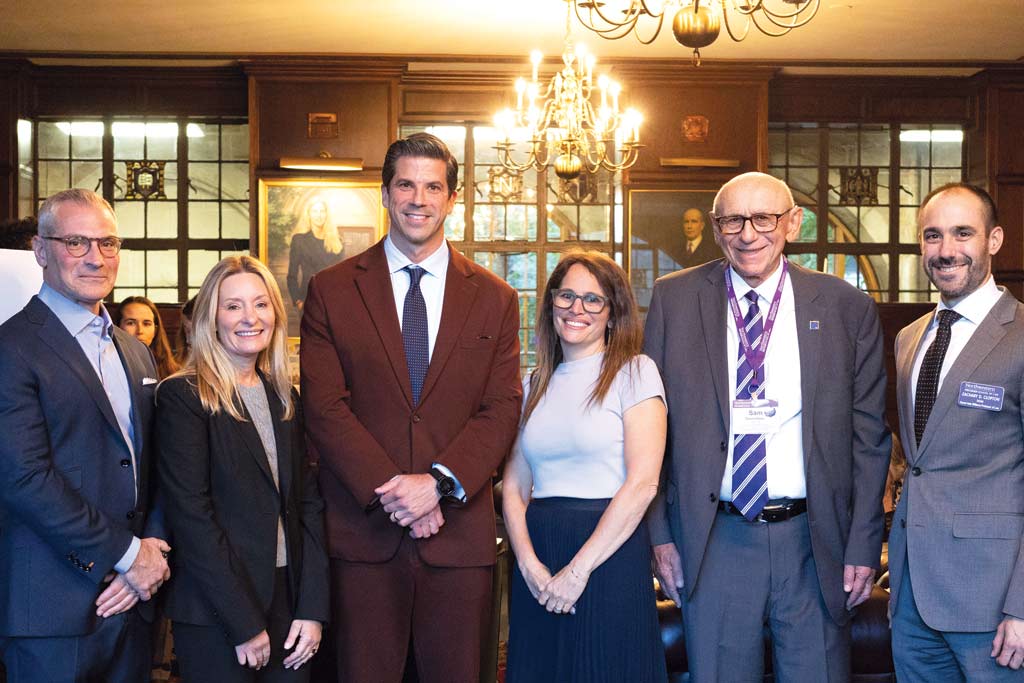 A photo of Howard J. Siegel, Alexis L. Siegel, Judge Roy K. Altman, Marjorie B. Moss, Sam Tenenbaum, and Dean Zachary D. Clopton at the launch of the Siegel Fund to Combat Antisemitism and the Antisemitism Legal Advocacy Project at Northwestern Pritzker School of Law. The symposium included a book talk with Altman, author of Israel on Trial, which filled Lincoln Hall to capacity.